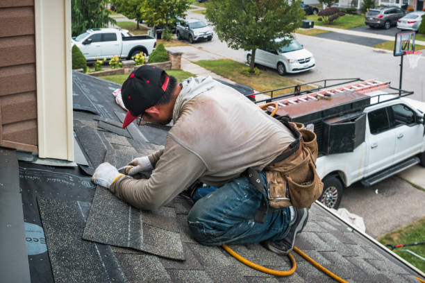 Professional Roofing technician working in MacDonnell Heights, NY